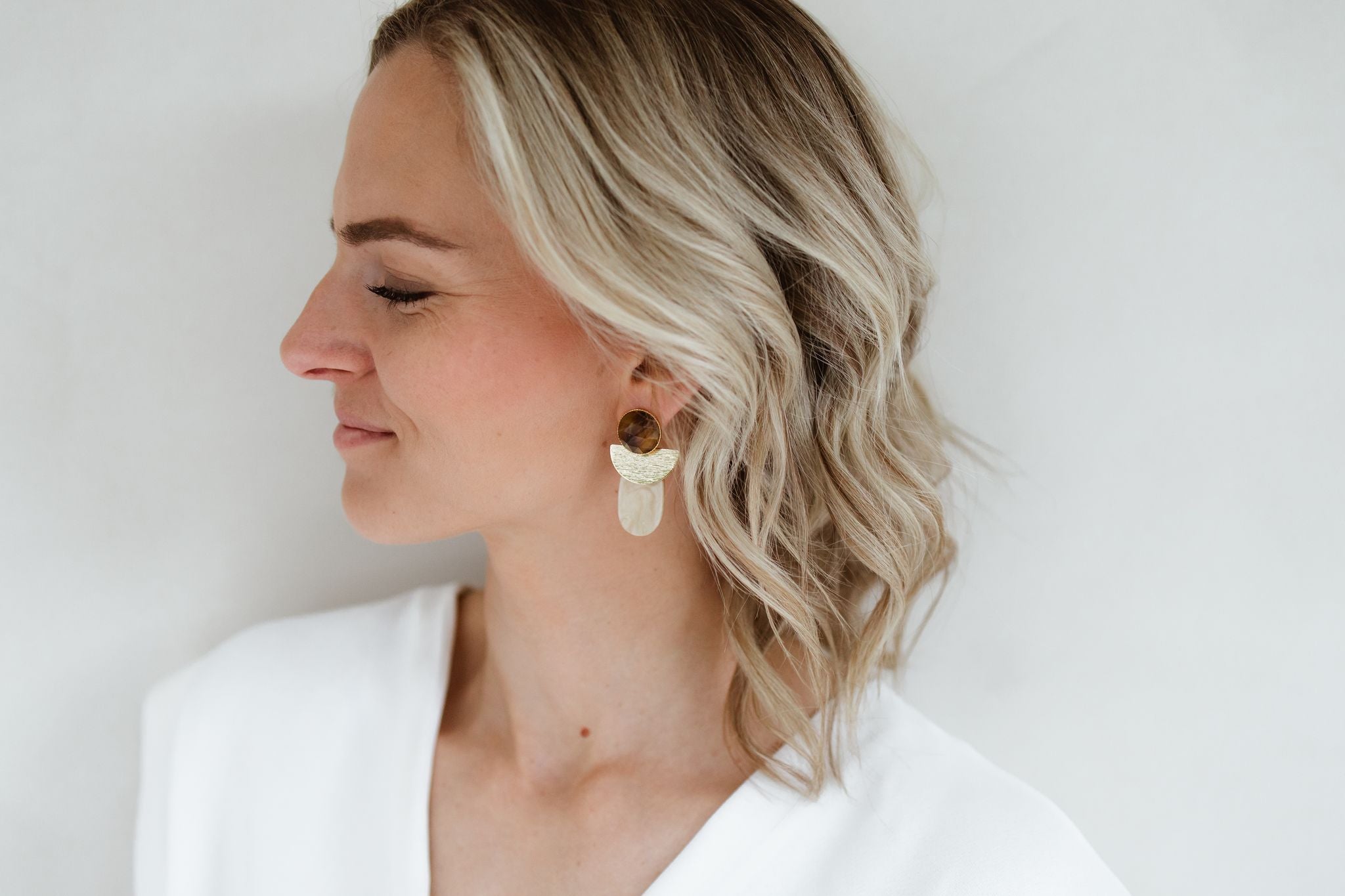 Hoe kies je de perfecte statement oorbellen voor jouw gezichtsvorm?