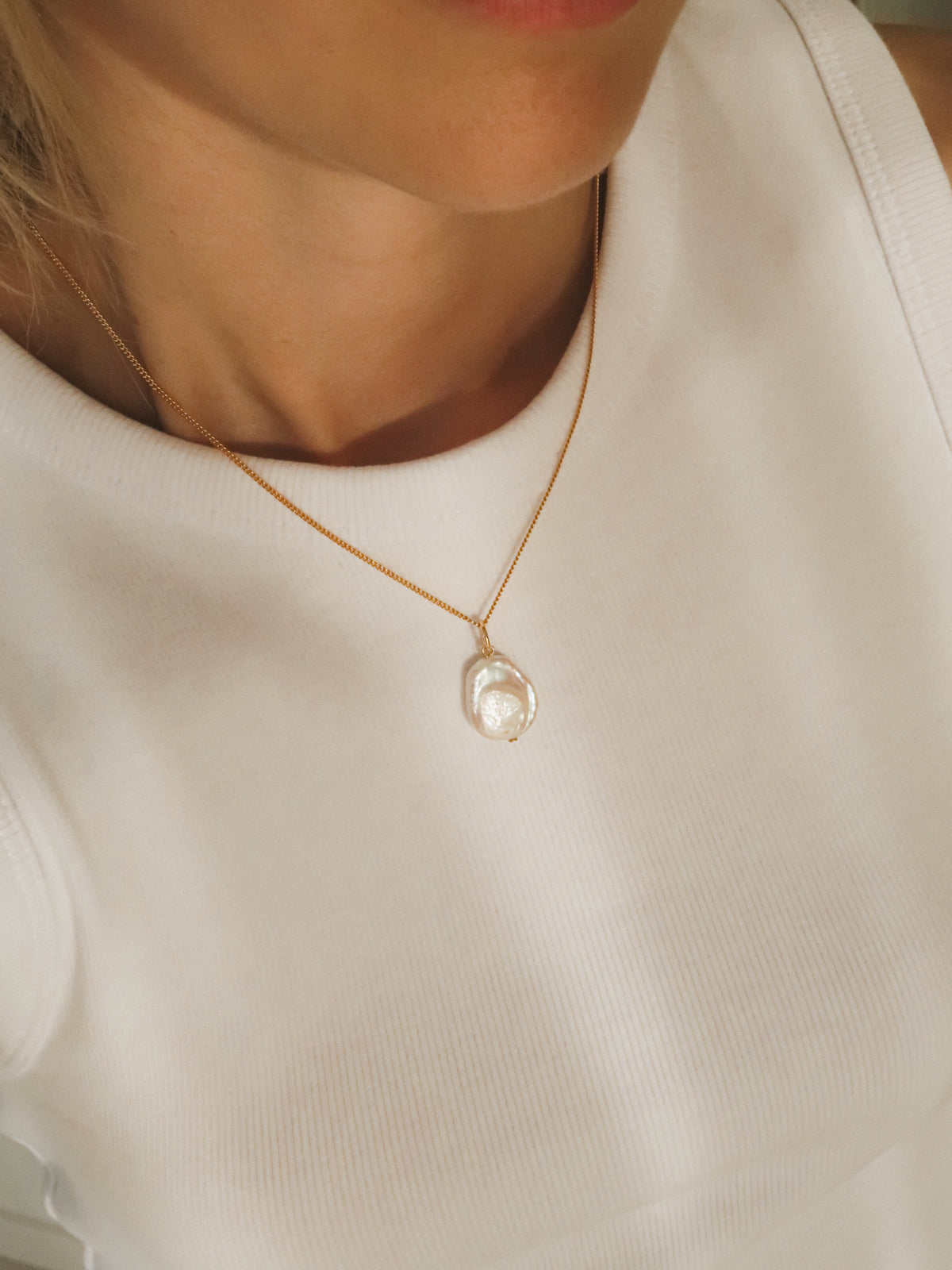 Flat pearl charm