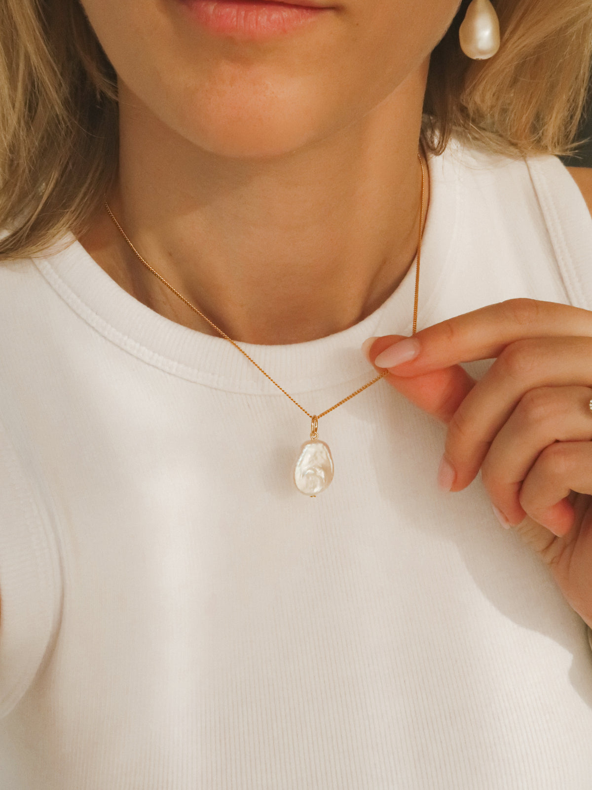 Flat pearl charm