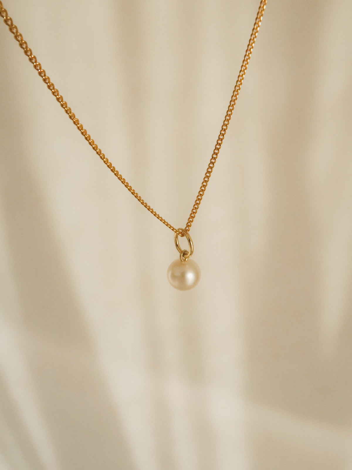 Small pearl charm