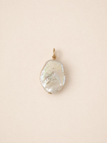Flat pearl charm