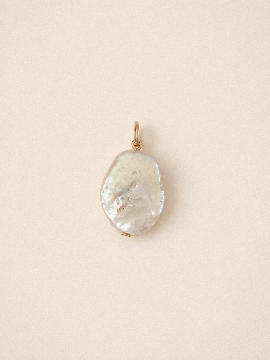 Flat pearl charm